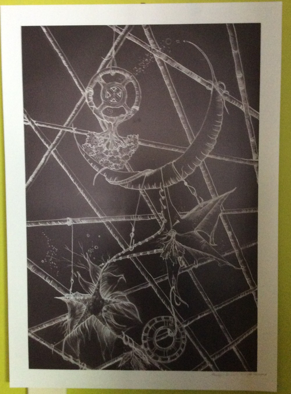 Image of white on black by Sandy Skinner (Journey to beautiful author). Image contains a matrix of lines from which a tree of life is suspended upside down with a crescent moon from which hangs stars and a prayer circle and various embellishments